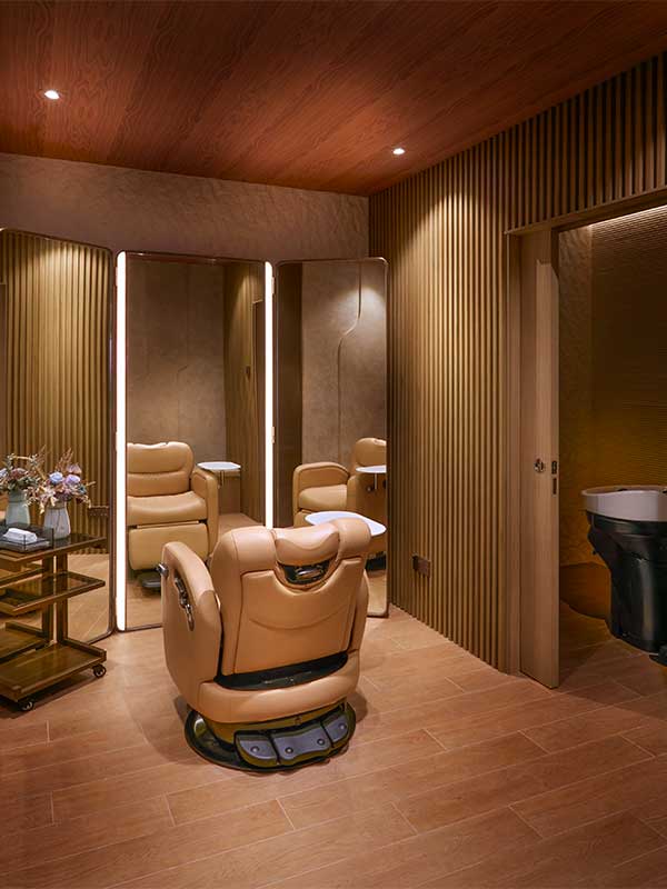 Private styling room with mirror and salon chair