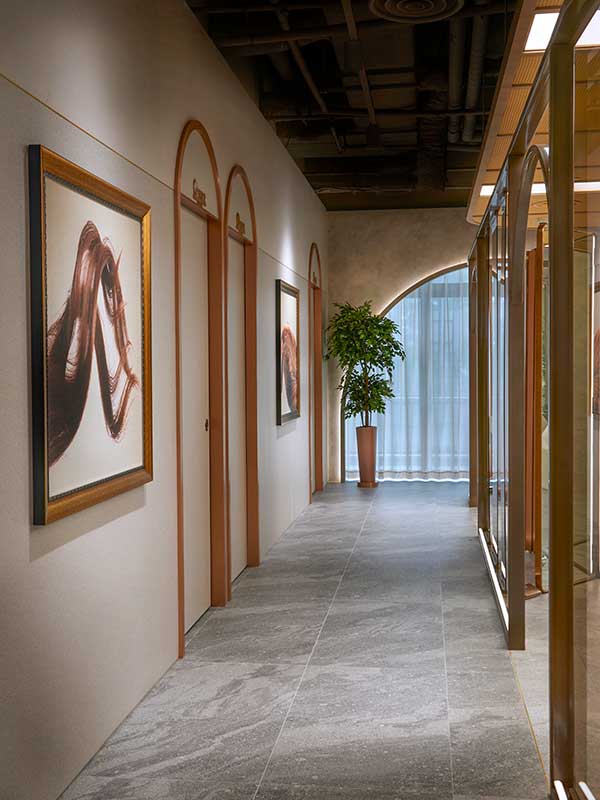 Elegant hallway with framed artwork and plant